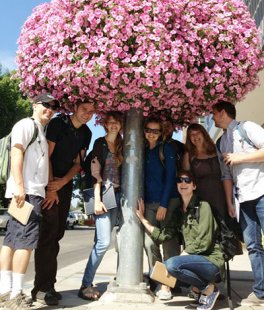 A group of students underneath flowers